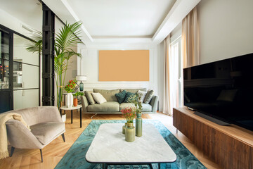 Living room with white and blue carpet on oak floor and decorated with, sofas and TV on sideboard,...