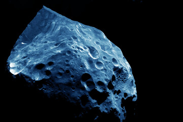 Asteroid in space on a dark background. Elements of this image furnished by NASA