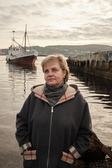 an aged woman in the port