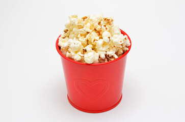 popcorn in bucket isolated on white background closeup