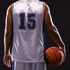 Never back down from a challenge. Cropped shot of a basketball player against a black background.