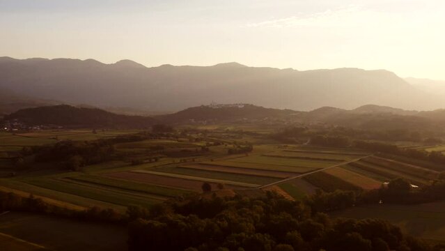 Early morning shot of Vipava valley, Slovenia, sun shines into camera