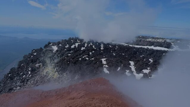 Caldera of Avachinsky stratovolcano, also known as Avacha Volcano. Swinging steam from hot geysers. Kamchatka Peninsula, Russia.