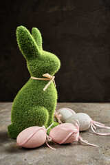 side view of an elegant Easter bunny statue made of grass
