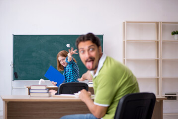 Two students having fun in the classroom