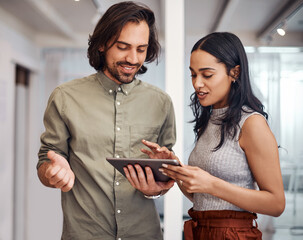 And then you click here.... Shot of two businesspeople using a digital tablet together in an office.