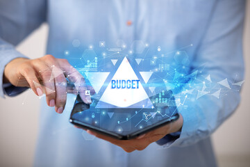 Businessman holding a foldable smartphone, business concept