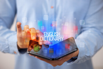 Young man holding a foldable smartphone