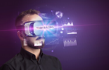 Businessman looking through Virtual Reality glasses