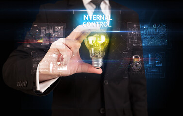 Businessman holding a light bulb, online security concept