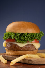 Hamburger served with fried potatoes.