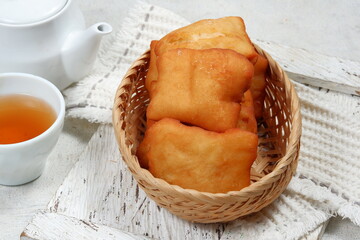 odading or beignet, indonesian fried bread on white background