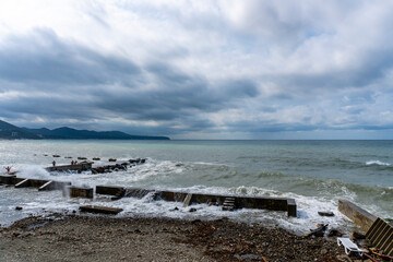 small storm on the sea, waves hitting the shore
