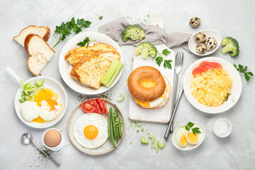Various ways of cooking chicken eggs on light background.
