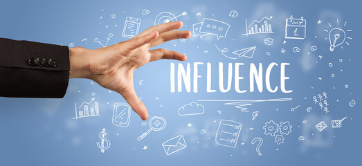 Close-Up of cropped hand pointing at business inscription