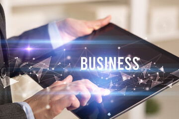 Close up hands using tablet