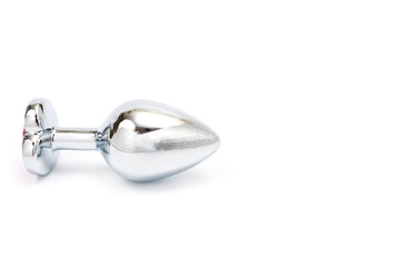 Metal butt plug with a decorative pink heart-shaped stone at the end.