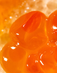 Red salmon caviar as a background.