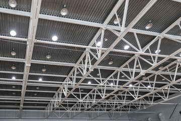 Lighting in a large sports hall as a backdrop.