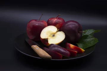 Fotobehang ed apples in a salad plate and a paring knife.Include Clipping Path. © homphoto