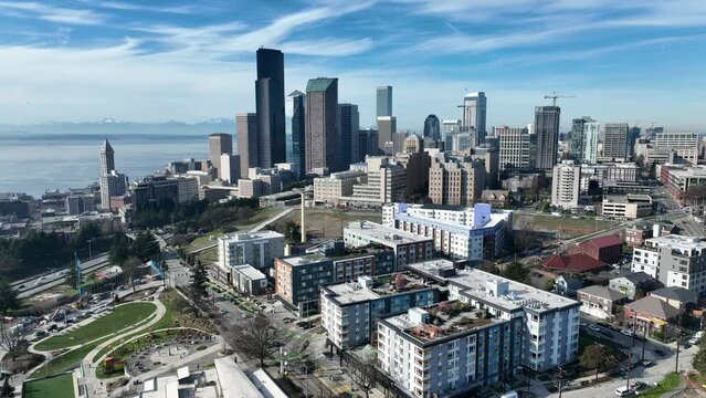 Cinematic 4K aerial drone trucking shot of First Hill, Yesler Terrace, Atlantic, Cherry Hill, Squire Park, skyscrapers and high-rise buildings downtown Seattle, Washington
