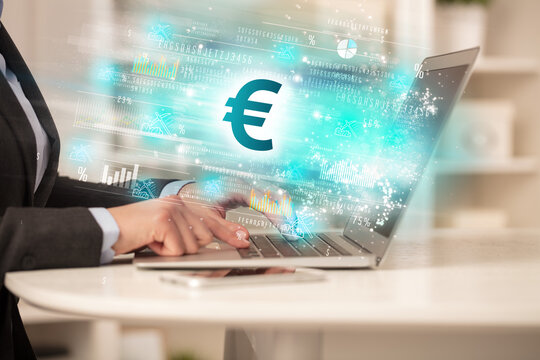 Young man watching stock market on laptop