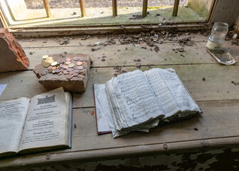 interior of an abandoned Orthodox church, old windowsill with old prayer books