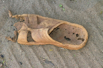 flip flop slippers left on the desert for long years effect of dryness sun and occasional rain