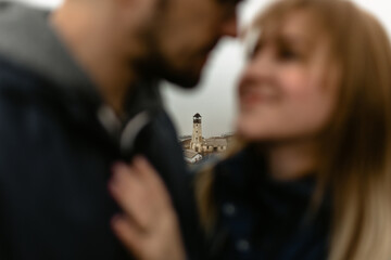 Couple kissing on the background of the pendulum