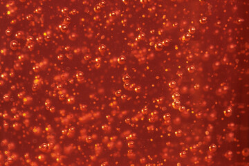 Randomly scattered air bubbles close-up, macro. Silvery metallic balls of mercury