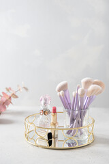 Professional visage brushes for face makeup on a table. Body art paint in beauty salon. Close up brush kit. Magazines, social media. Visagist tools. Vertical, copy space