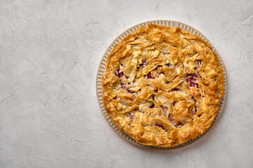 Homemade cherry pie from filo dough. Flat lay. Copy space