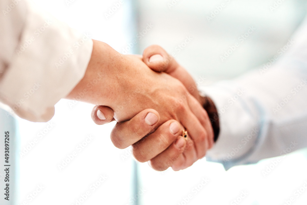 Poster work with those who want to succeed with you. closeup shot of two unrecognisable businesspeople shak