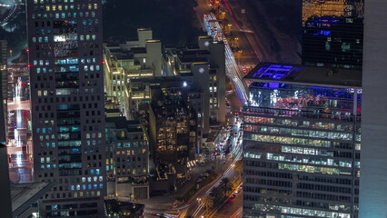 Fototapeta na wymiar Office skyscrapers in financial district aerial night timelapse