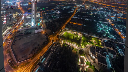 Garden in Zabeel district with skyscrapers on a background aerial all night timelapse in Dubai, UAE