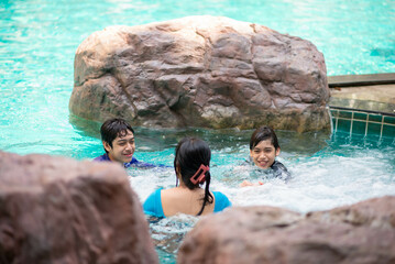 Asian family on vacation at  waterpark outdoor - 493898013