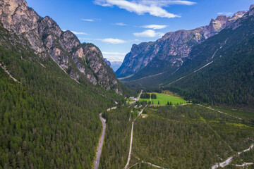 Aerial view of the green mountains forest in Dolomites, Italy