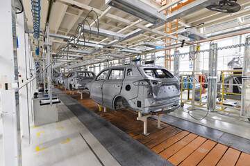 Plant for production of cars. Modern automotive industry. Electric car factory, conveyor