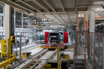 Automobile production line. Modern car assembly plant. Interior of a high-tech factory, manufacturing