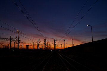 Colorful sky just after sunset with visible railway infrastructure.
