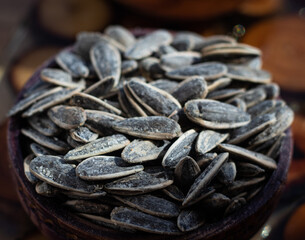 Unpeeled sunflower seeds in bowl