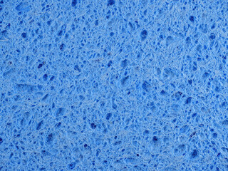 Fototapeta na wymiar Blue porous wash sponge texture as an abstract background