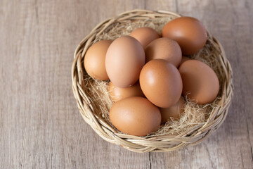 fresh chicken eggs in a wicker basket