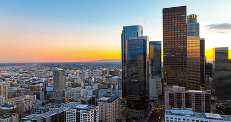 Sunset over Los Angeles downtown. Los Angels downtown skyline, panoramic city skyscrapers.