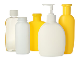 Bottles of baby cosmetic products on white background
