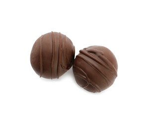 Obraz na płótnie Canvas Delicious sweet chocolate truffles on white background, top view