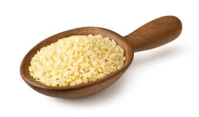 Raw hemp seeds in the wooden spoon, isolated on the white background.