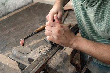 Man assembling furniture and fixing it - hobby garage concept.