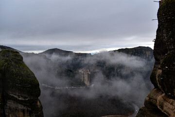 Monastery in the fog in the mountains