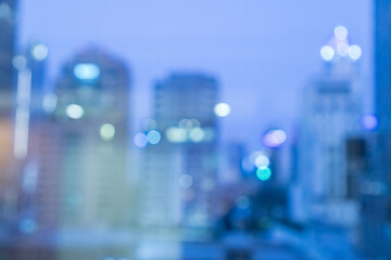 Blur image of city scape building in the night with light bokeh